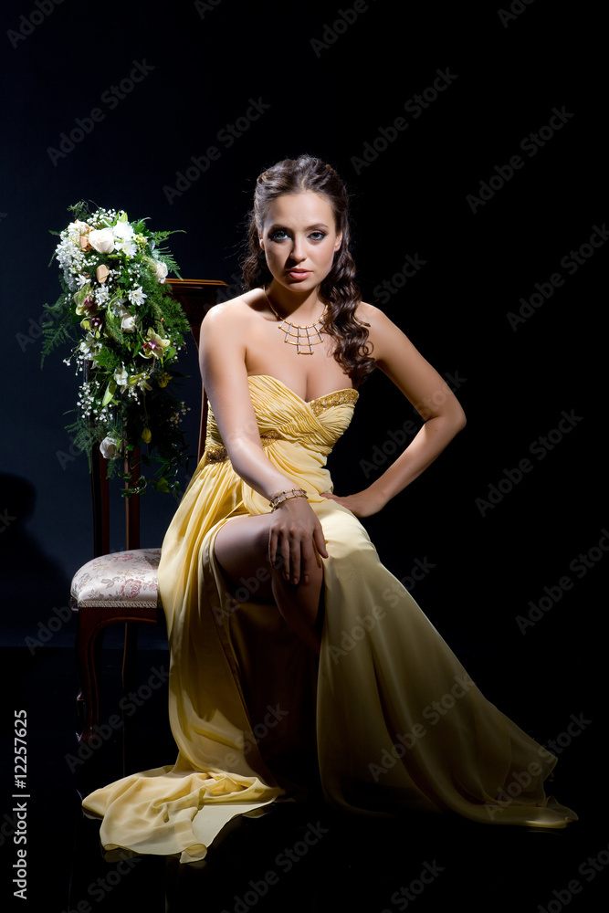 Fototapeta premium Young Woman In Yellow Dress