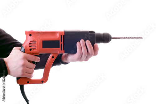 hands holding perforator
