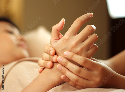 A woman getting manicure at a day spa
