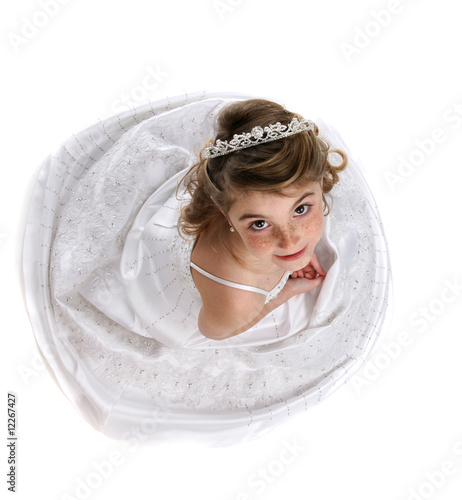 looking down on cute girl in white gown and tiarra