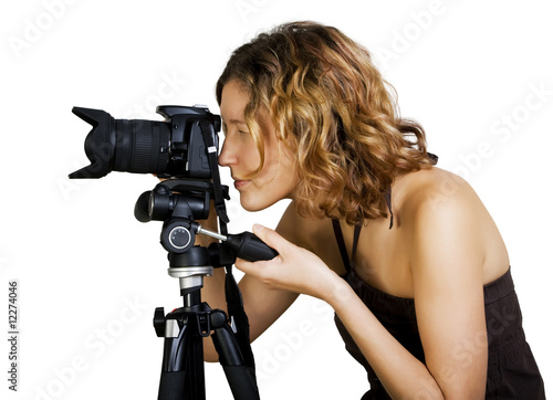 Young beautiful  woman  with photo camera and tripod