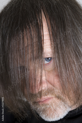 Man peering through hair.