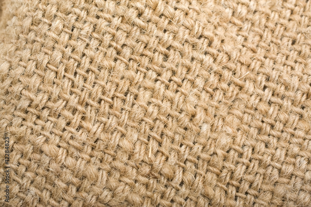 Textured background of a sandy brown burlap cloth Textured background of a sandy brown burlap cloth
