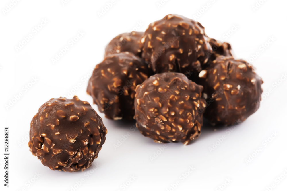 Chocolates with nut on white background Chocolates with nut on white background
