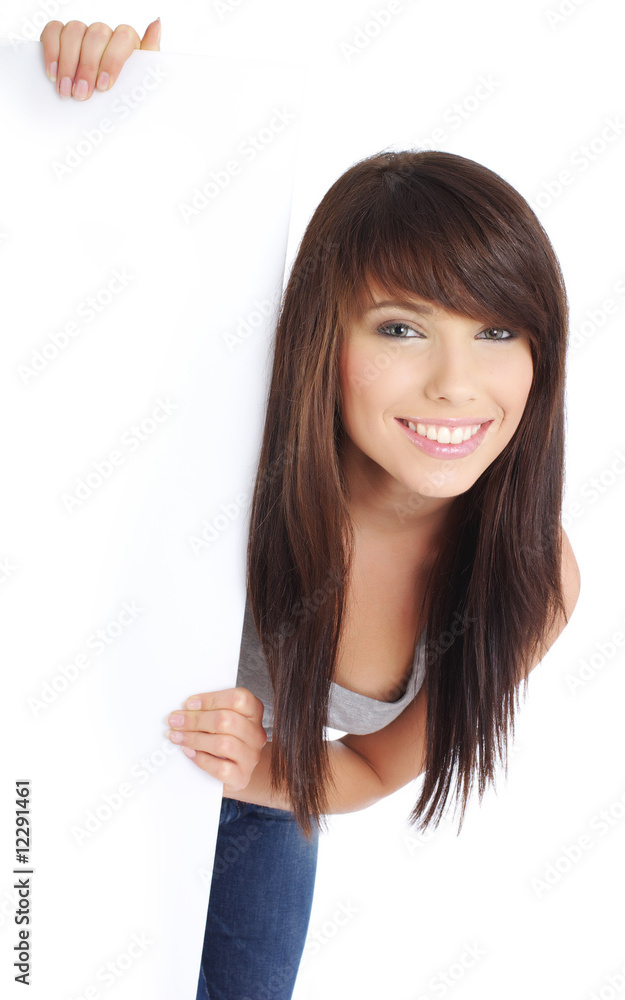 Portrait of a beautiful woman holding a blank billboard Portrait of a beautiful woman holding a blank billboard