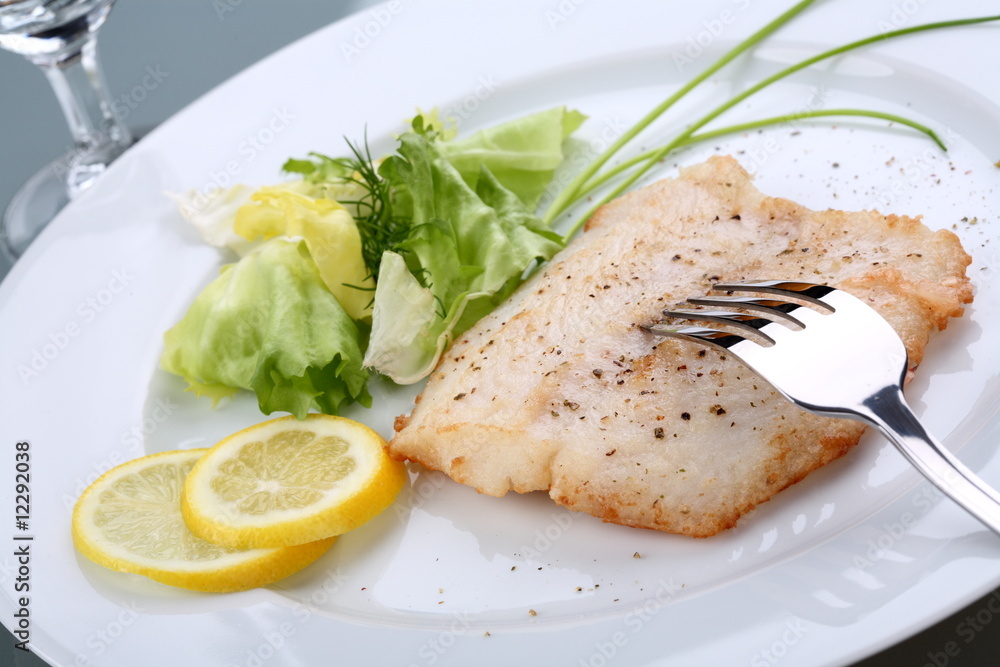 Fish dish - roasted cod with vegetable salad Fish dish - roasted cod with vegetable salad