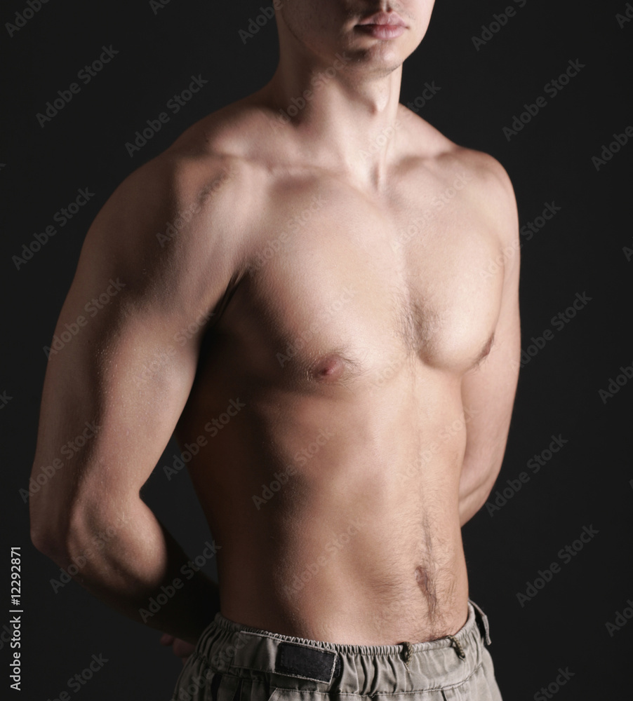 Young Sporty Man over Black Background, Body Parts Young Sporty Man over Black Background, Body Parts