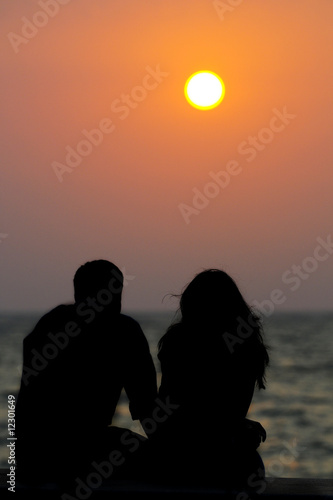 Couple watching a sun set