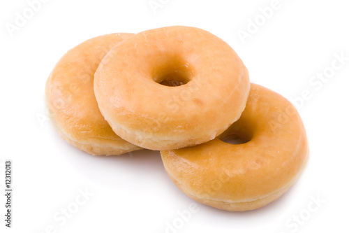 Three doughnuts or donuts piled isolated on white