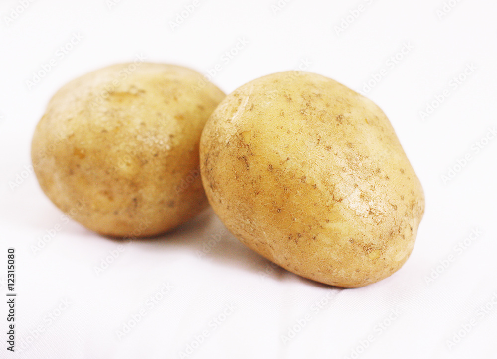 Close up of Two Potatoes on White Background Close up of Two Potatoes on White Background