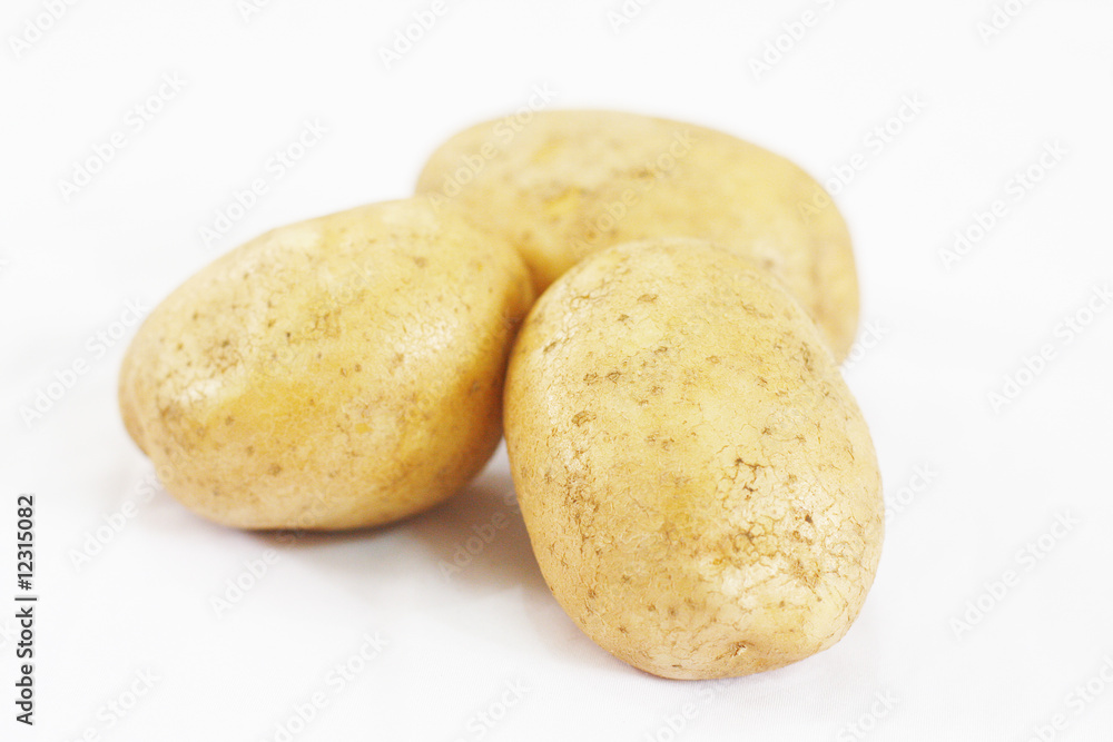 Close up of Three Potatoes on White Background Close up of Three Potatoes on White Background