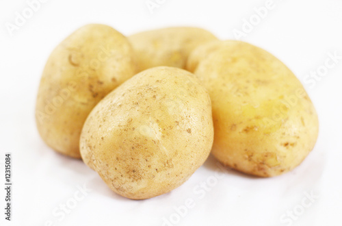 Close up of Four Potato on White Background