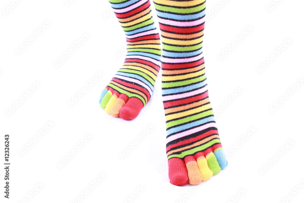 woman legs in strip sock on white background woman legs in strip sock on white background