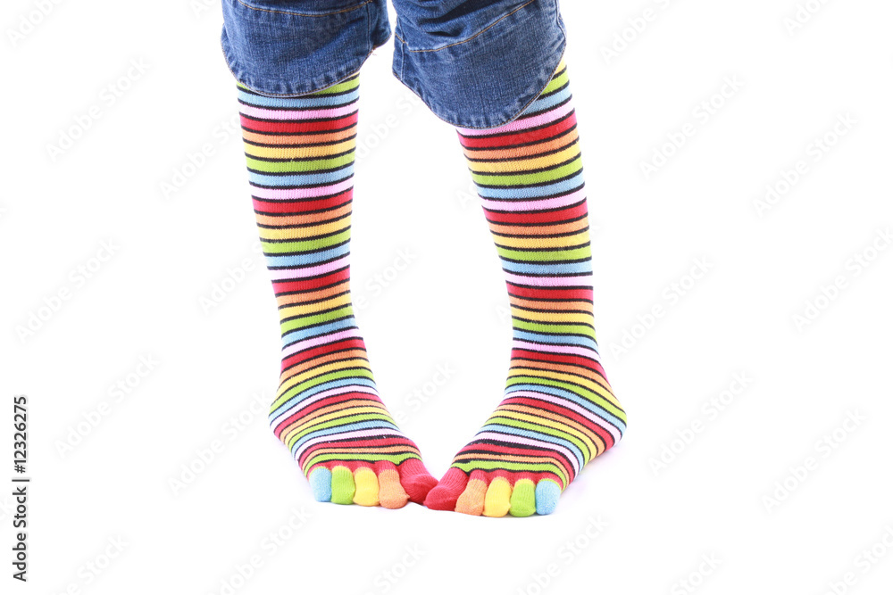 woman legs in strip sock on white background woman legs in strip sock on white background