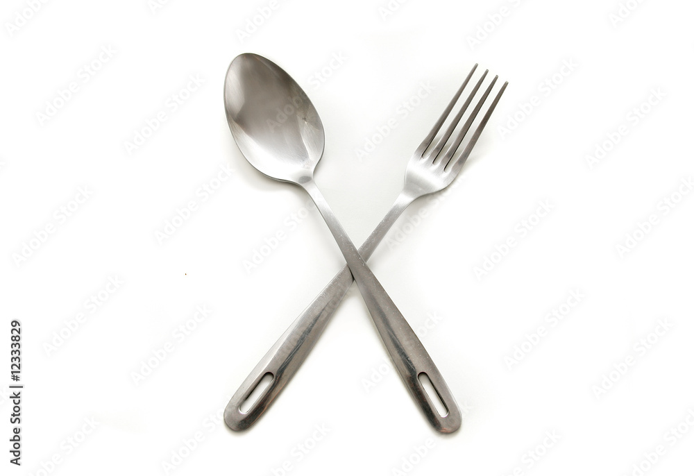 concept shot of spoon and fork over white concept shot of spoon and fork over white