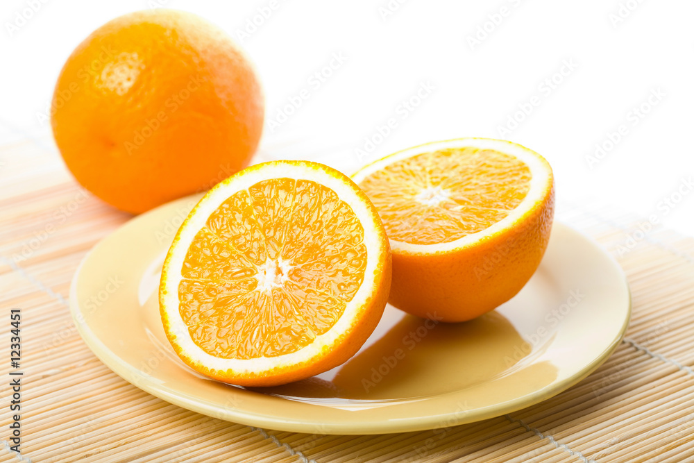 ripe oranges in yellow plate isolated ripe oranges in yellow plate isolated