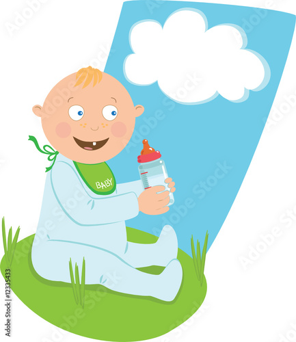 Baby with a milk bottle on the grass