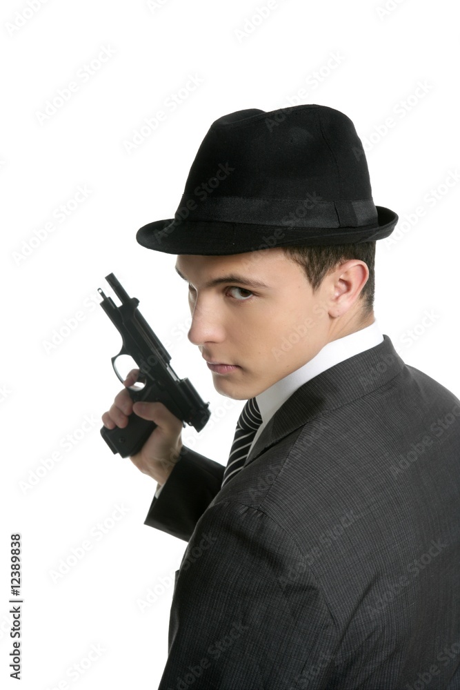 Classic mafia portrait, man with black suit and gun Classic mafia portrait, man with black suit and gun