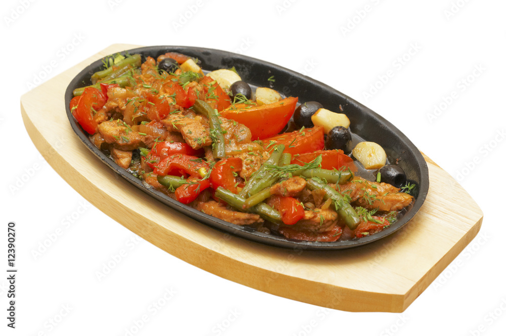 Fototapeta premium Roastpig with vegetables on carving board