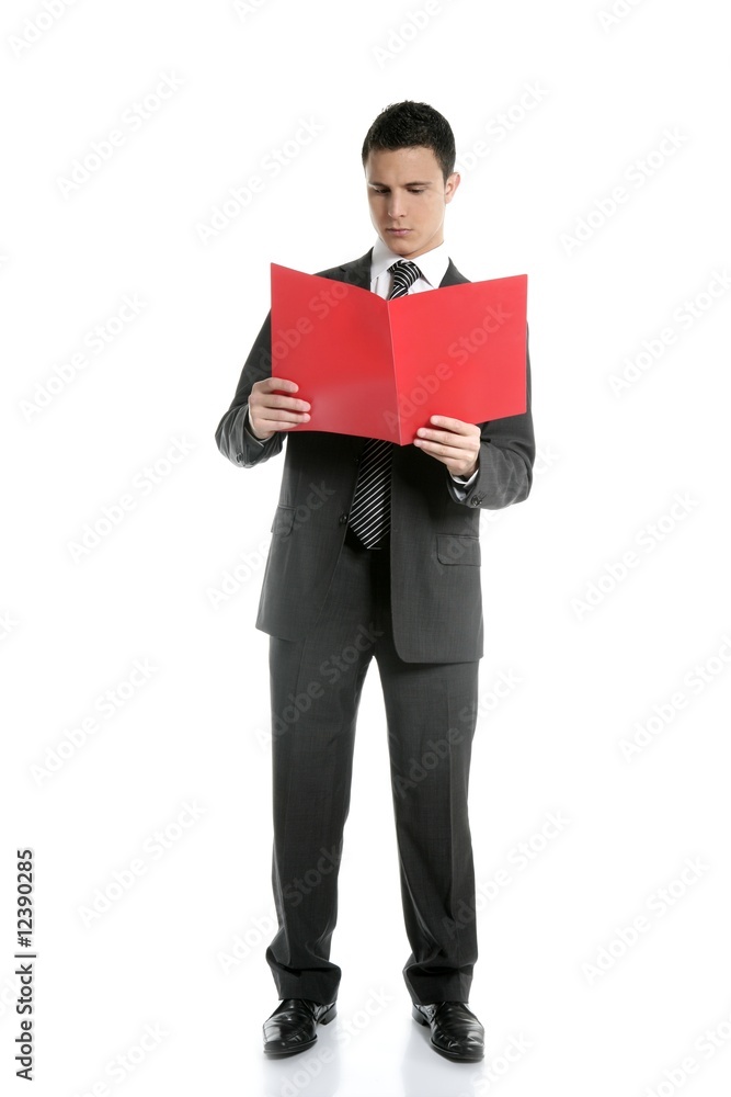 Full body businessman reading red folder at studio Full body businessman reading red folder at studio
