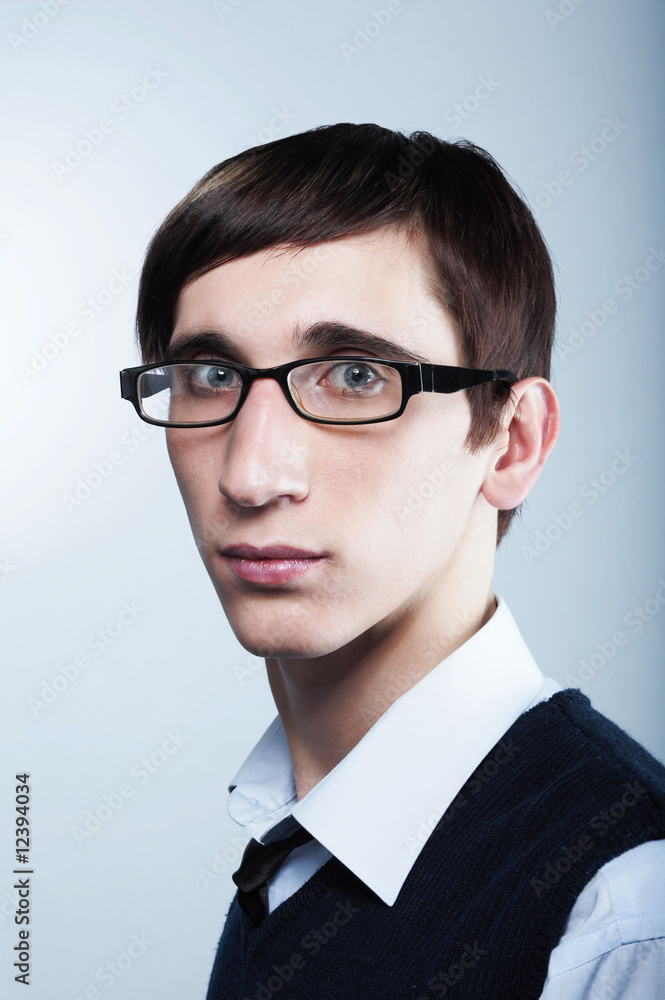 cute young guy with fashion haircut wearing glasses