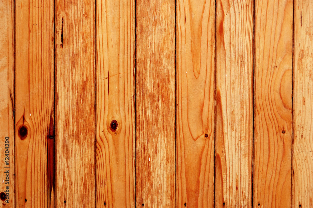 Fototapeta premium Wooden fence made of unfinished pine boards