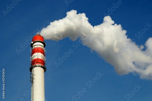 Chimney smoke with blue sky