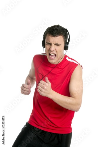 Young handsome man running, jogging over white