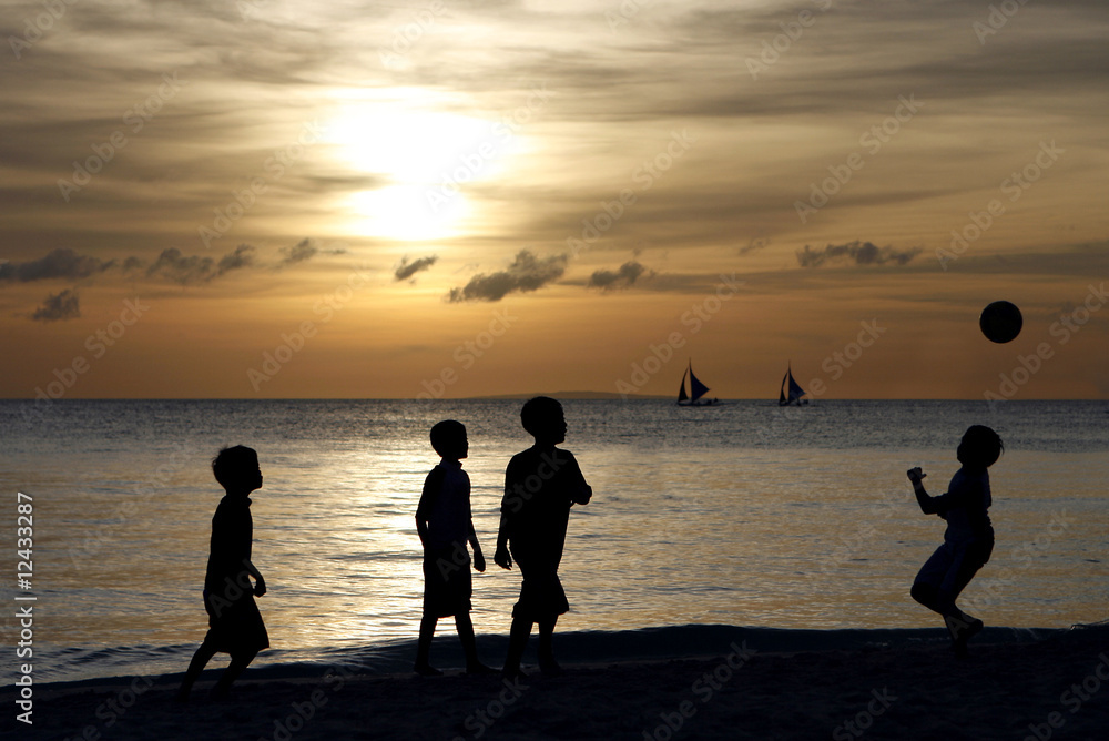 Silhouette of Children Playing at the Beach