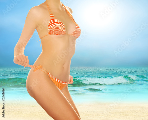 Young beautiful women on the sunny tropical beach