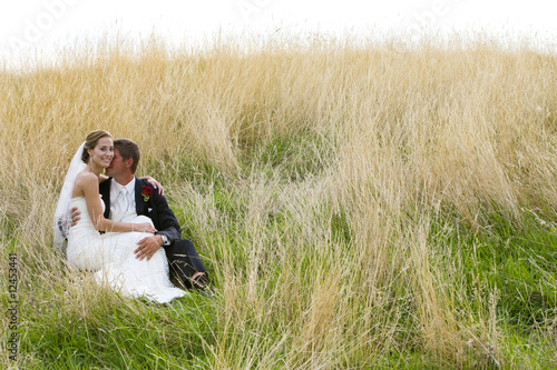 wedding couple in grass © Mat Hayward