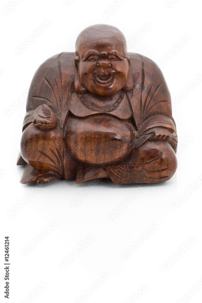 Smiling wooden buddha isolated on a white background Smiling wooden buddha isolated on a white background