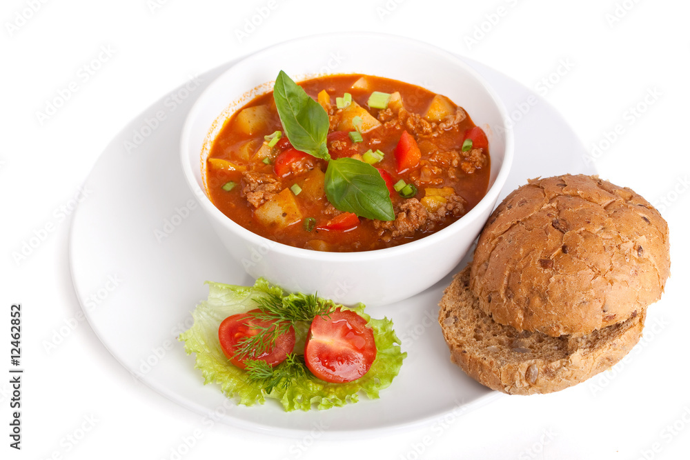 serving of minced meat and vegetable tomato soup isolated