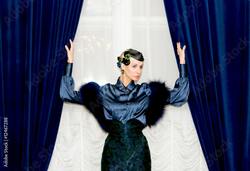 girl between two curtains