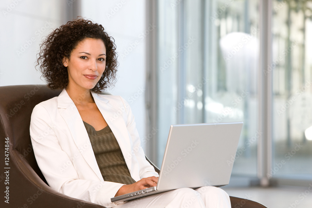 Attractive business woman working on laptop Attractive business woman working on laptop