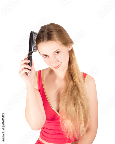 Girl combing her long hair