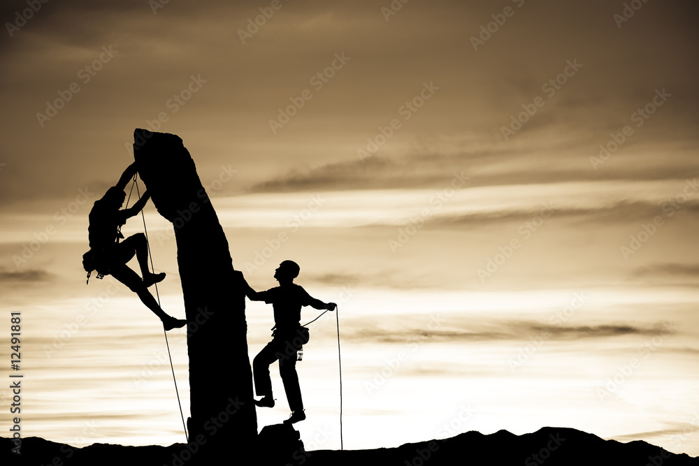 Team of climbers reaching the summit. Team of climbers reaching the summit.