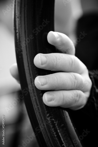 child's hand on metal bar