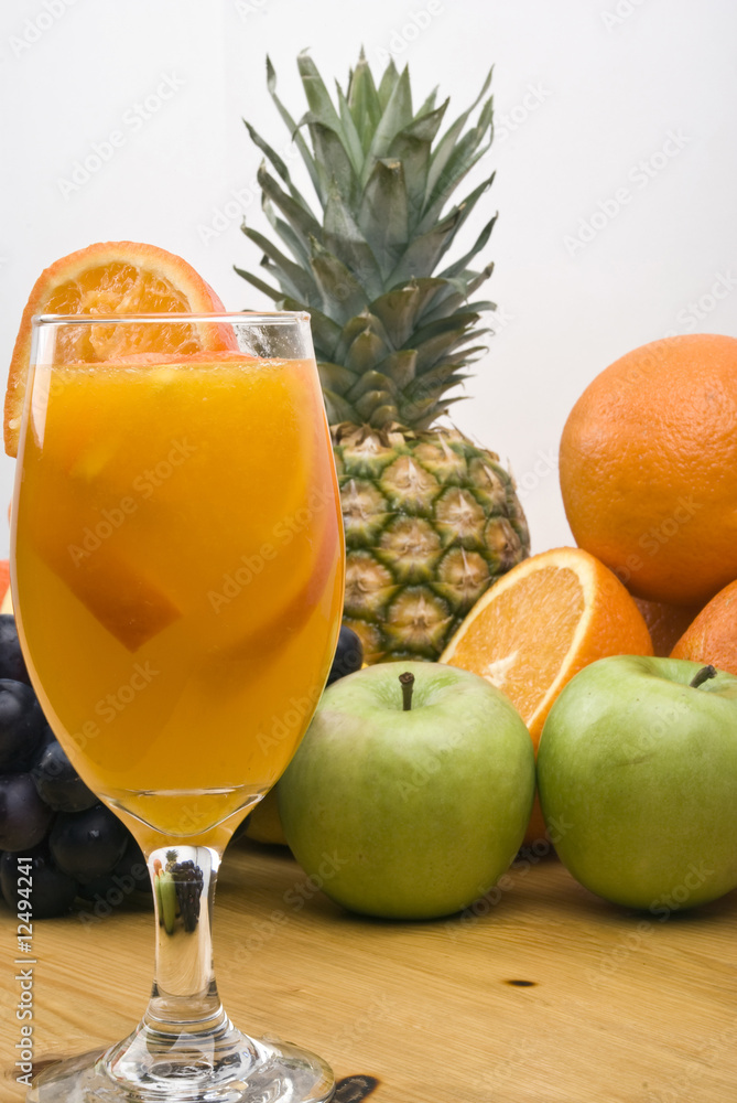 Glass with fresh orange juice and fruits