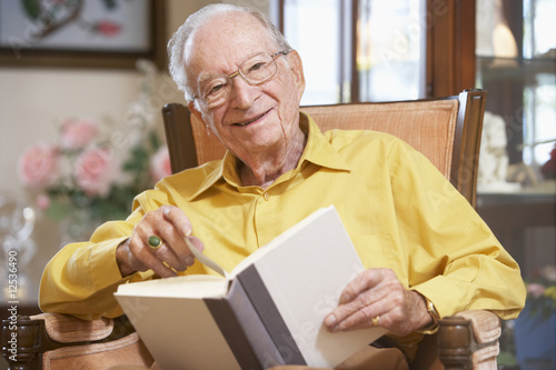 Senior man reading book