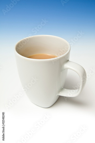 A white china mug of tea.