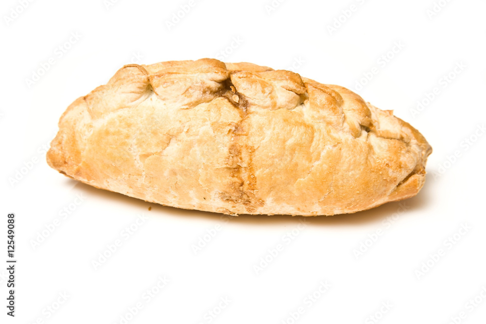 Cornish pasty isolated on a white studio background. Cornish pasty isolated on a white studio background.