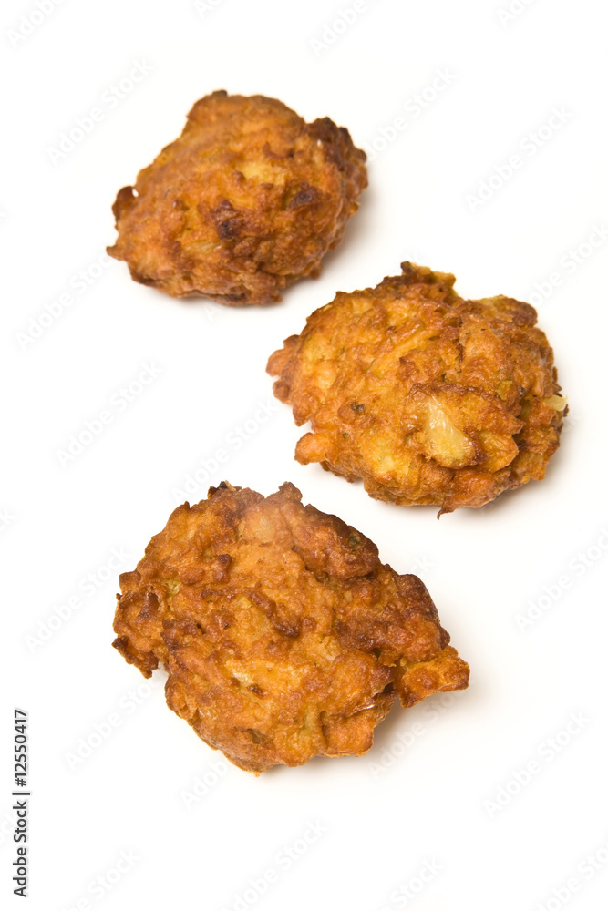 Onion Bhaji's isolated on a white studio background. Onion Bhaji's isolated on a white studio background.
