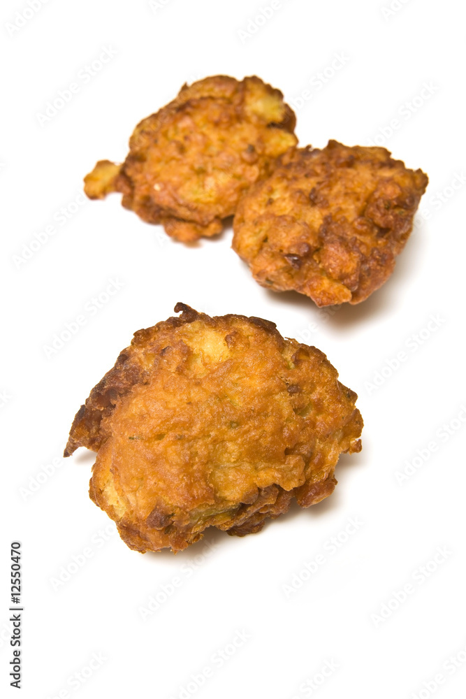 Onion Bhaji's isolated on a white studio background. Onion Bhaji's isolated on a white studio background.