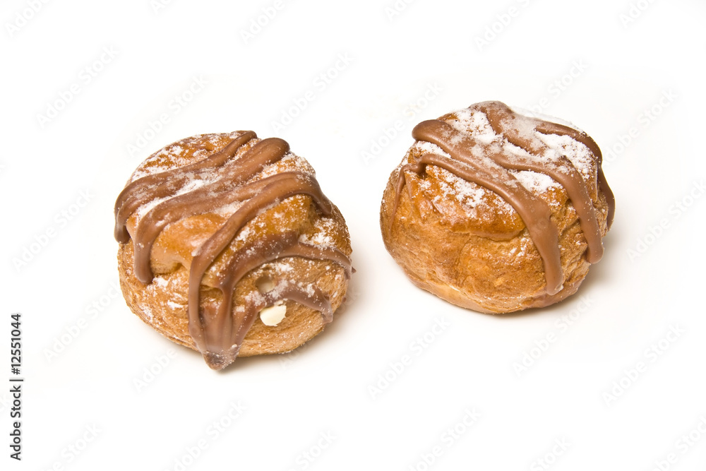 Fototapeta premium Cream buns isolated on a white studio background.