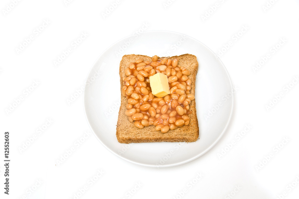Plate of baked beans on toast, isolated on a white background. Plate of baked beans on toast, isolated on a white background.