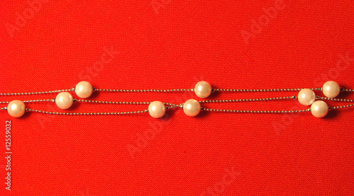 beads from paste pearl on a red background