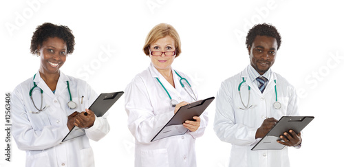 Team of three doctors writing
