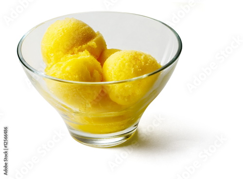 Yellow Ice-cream balls in transparent glass