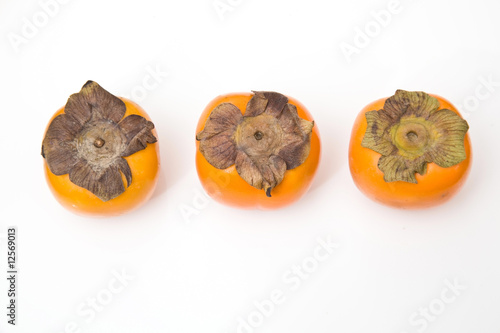 Sharon fruit isolated on a white studio background. photo